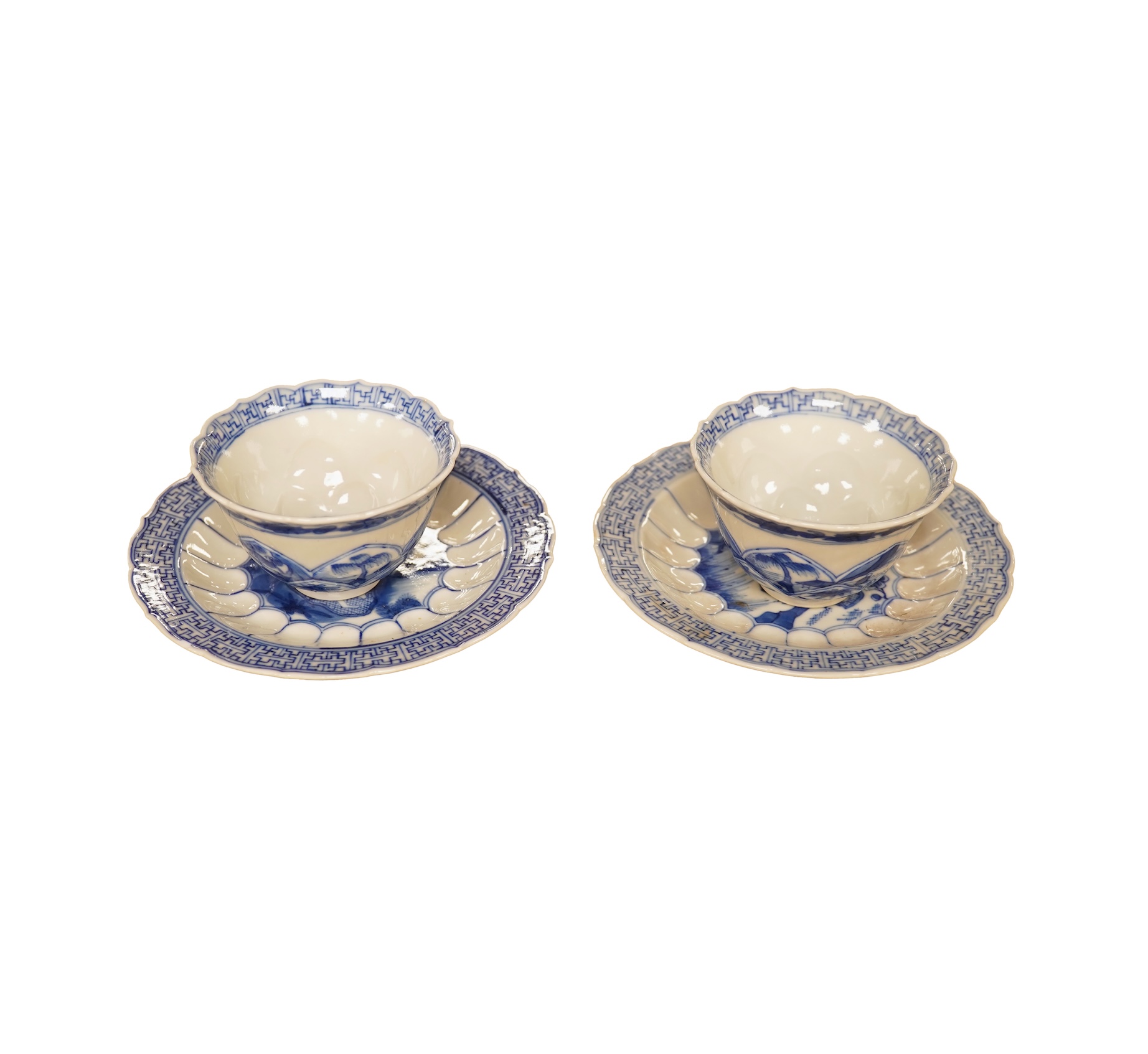 Two Chinese blue and white tea bowls and saucers, saucer 10cm diameter.